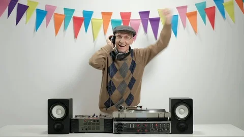 Old DJ playing music and gesturing happiness Stock Footage