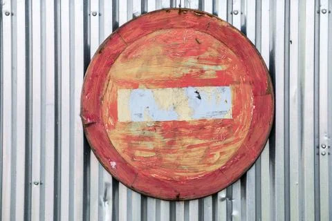 Old do not enter sign on galvanized profiled metal sheet wall. Stock Photos