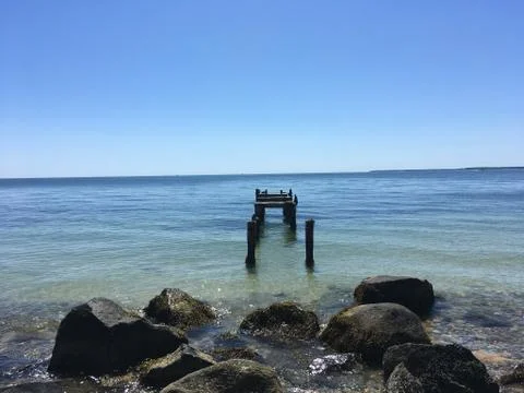 Old dock near Cape Cod bike path Stock Photos