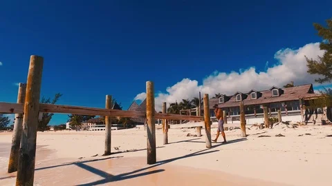 Old Dock at Taino Beach Extending Into the Sea, Freeport Bahamas Stock Footage 98517610