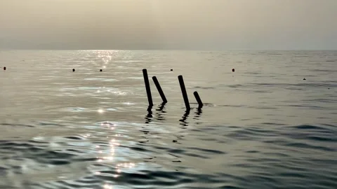 The old dock in the waves during the colors of the sunrise Stock Footage 160834395