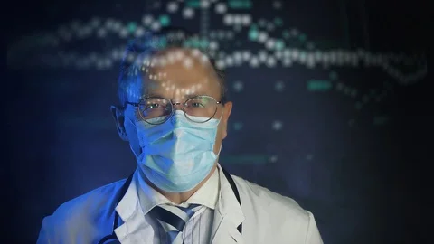 Old doctor in mask looking at augmented reality screen Stock Footage 129350170