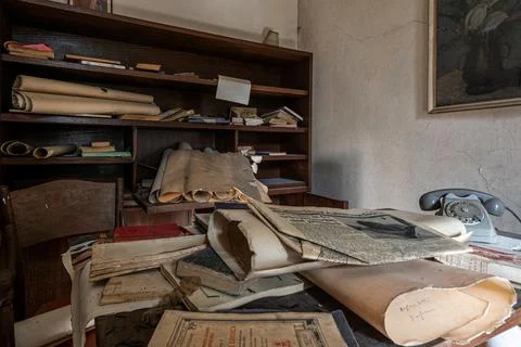 Old documents left on an office desk in an abandoned house. urbex Stock Photos