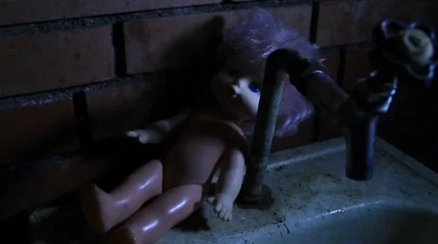Old doll on old broken sink - scary / horror details Stock Footage 48397493