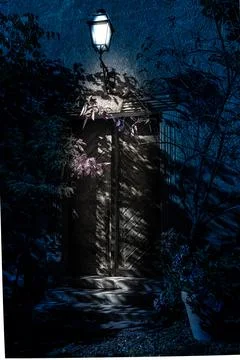Old door and a lantern of an old building at night Stock Photos