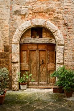 Old door in of brick building .. Stock Photos