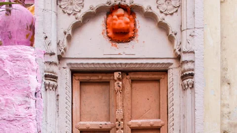 An old door in a brick wall. Pink brick. Pastel shades. Video stock 86367831