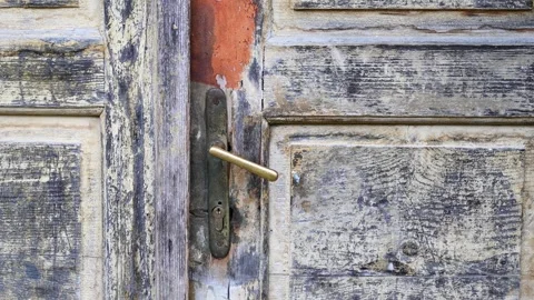 Old Door handle, close up. Old door handle and key lock on old wooden door. Video stock 243229253