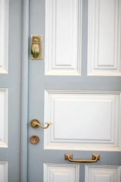 Old door handle in a typical painted blue on the of Santorini Stock Photos