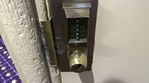 Old door hardware with a combination lock Stock Footage 144313842