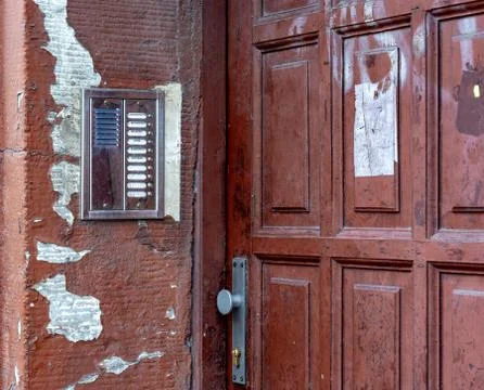 The old door of the House. intercom on the old wall Stock Photos