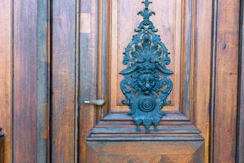Old door with an interesting ornament, close-up. Stock Photos
