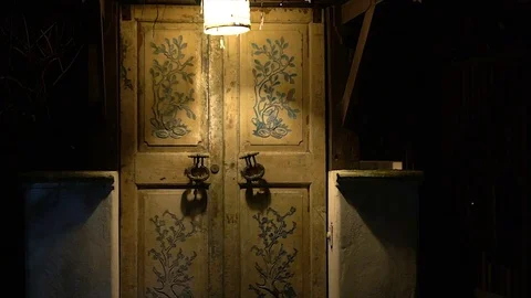 An old door with large handles and a keyhole in a vintage style. Stock Footage 77616719