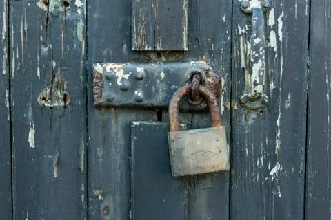 Old door with padlock Stock Photos