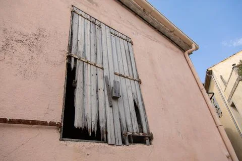 A old door on the side of a building 스톡 사진