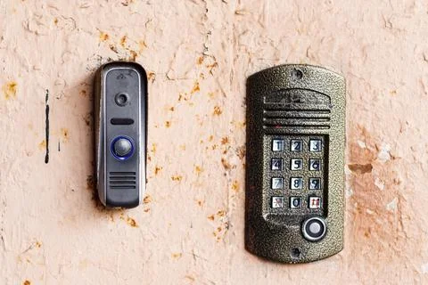 Old doorbell button panel and intercom. Stock Photos