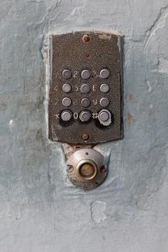 Old doorbell button panel and intercom. Stock Photos
