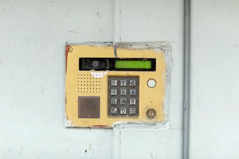 Old doorbell button panel and intercom. Stock Photos