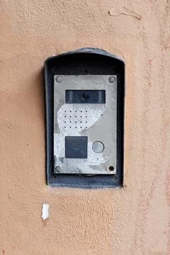Old doorbell button panel and intercom. Stock Photos
