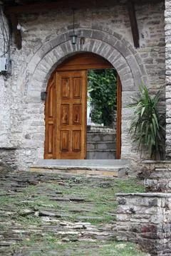 Old doors and windows damaged from weather in ancient city of Gjirokaster i.. Stock Photos