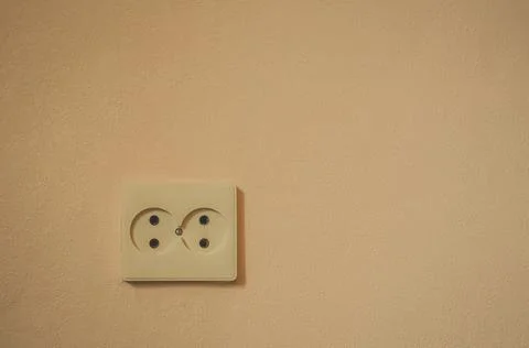 Old double wall-built electrical outlet. Background, selective focus Stock Photos