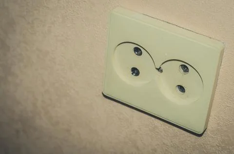 Old double wall-built electrical outlet. Background, selective focus Stock Photos