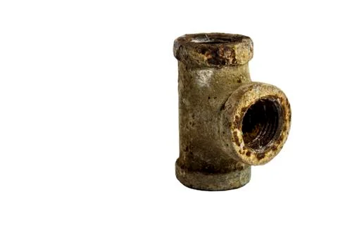 Old drainpipe three way with rust Stock Photos