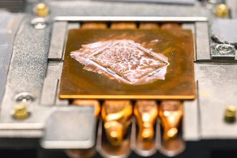 Old dried thermal paste on a computer radiator, computer repair and maintenan Stock Photos