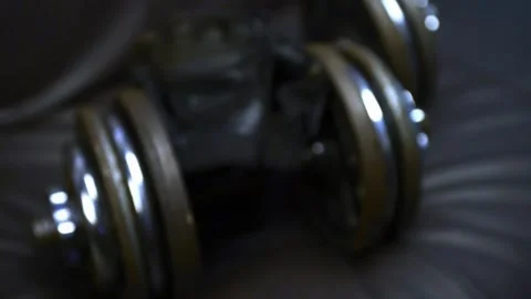 Old dumbbells rusted on a couch with worn gym gloves 스톡 동영상 143232699