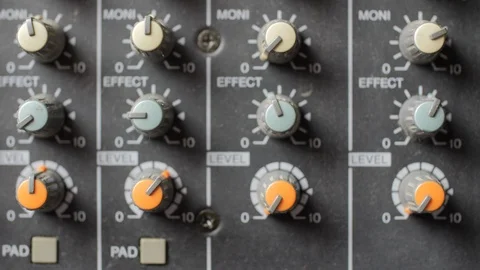 Old dusty audio console closeup. Changing lighting. Focus on knobs. 動画素材 112914588