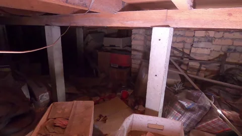 Old dusty boxes and junk under a house or in an attic. Stock Footage 141736649