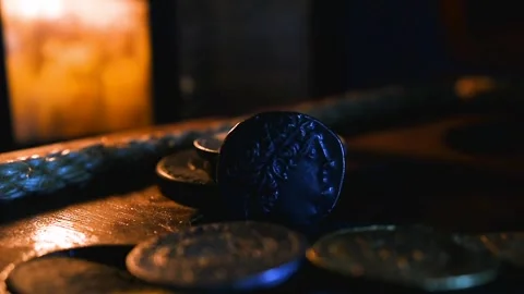 Old Egypt Coin illuminated by candlelight. Stock Footage 333609592
