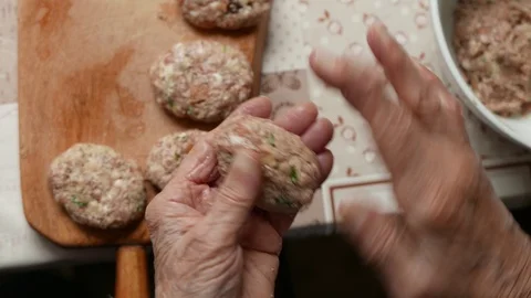 Old Elderly Hands Preparing Hamburger Patties at Home Stock Footage 99660025