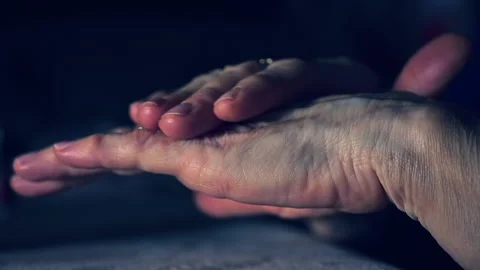 Old elderly lady applying cream on her hands marked by time Stock Footage 148353539