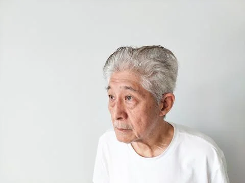 Old Elderly Thin Asian Man Standing Against Wall Background Stock Photos