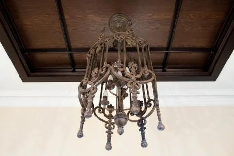 Old electric chandelier lamp on ceiling Stock Photos