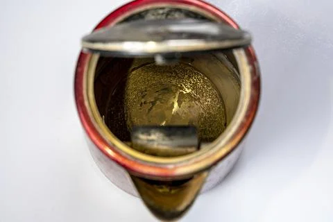 An old electric kettle with traces of scale and limescale Foto stock