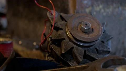 An old electric motor with wires is lying on the floor Stock Footage 156100735