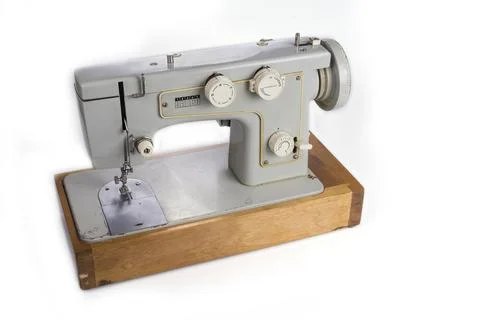 Old electric sewing machine on a white Stock Photos