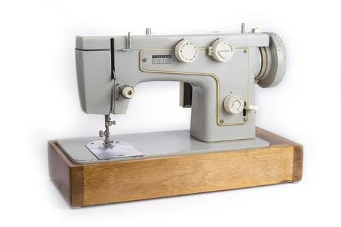 Old electric sewing machine on a white Stock Photos