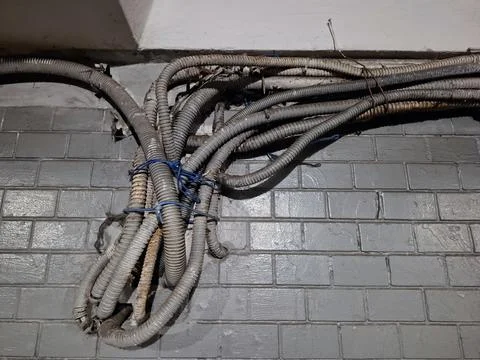 Old electrical cables in protective boxes Stockfoto's
