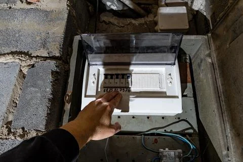Old electrical fuse box on the basement wall, power outage repair in an old.. Stock Photos