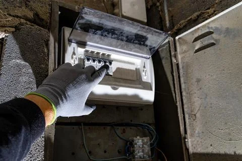 Old electrical fuse box on the basement wall, power outage repair in an old.. Stock Photos