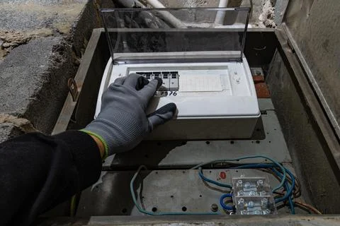 Old electrical fuse box on the basement wall, power outage repair in an old.. Stock Photos