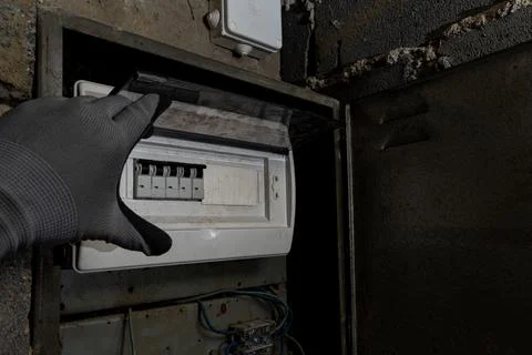 Old electrical fuse box on the basement wall, power outage repair in an old.. Stock Photos