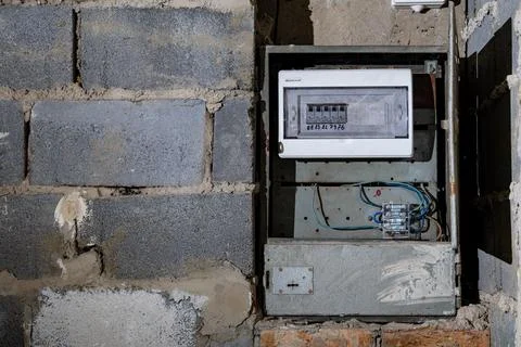 Old electrical fuse box on the wall in the basement, removing power failure.. Stock Photos