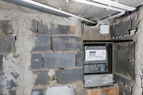 Old electrical fuse box on the wall in the basement, removing power failure.. Stock Photos