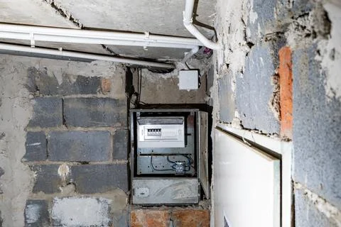 Old electrical fuse box on the wall in the basement, removing power failure.. Stock Photos