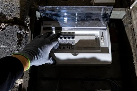 Old electrical fuse box on the wall in the basement, removing power failure.. Stock Photos