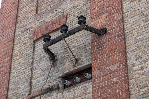 Old electrical insulators on a rusty bracket Fotos Stock